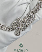 Sterling silver Cuban link chain with VVS moissanite diamonds and a customized name pendant, hiphop jewelry by Kynora Jewels.