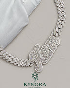 Sterling silver Cuban link chain with 10mm VVS moissanite diamonds and customized name pendant, hiphop jewelry by Kynora Jewels.