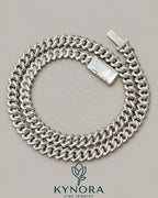 Kynora Jewels 18-inch sterling silver Miami Cuban link chain with 10mm VVS moissanite diamond accents, custom lock style.
