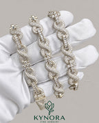 Kynora Jewels 10mm VVS Moissanite diamond infinity and cross pendant on 925 silver Cuban chain, hip-hop jewelry style.