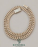 Sterling silver and rose gold Miami Cuban link chain with 10mm VVS Moissanite diamonds, hiphop style from Kynora Jewels.