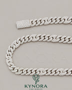 Sterling silver VVS1 moissanite Miami Cuban link chain, 10mm hip-hop jewelry by Kynora Jewels with intricate chain links.