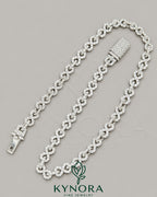 Sterling silver hip hop chain with 10mm VVS1 moissanite diamonds, custom unisex infinity design by Kynora Jewels.