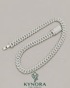12mm VVS Moissanite diamond Miami Cuban link chain in 925 silver, hip-hop jewelry by Kynora Jewels, close-up view of the chain.