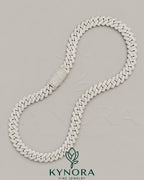 Sterling silver Cuban link chain with 12mm VVS1 Moissanite diamonds, stylish hip-hop jewelry by Kynora Jewels.