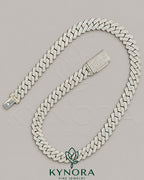 Sterling silver Miami Cuban link chain with 12mm VVS1 Moissanite diamonds, hip-hop jewelry style by Kynora Jewels.