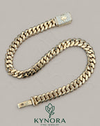 14mm gold Miami Cuban chain with custom clasp and moissanite diamonds, featuring a sleek, plain design by Kynora Jewels.