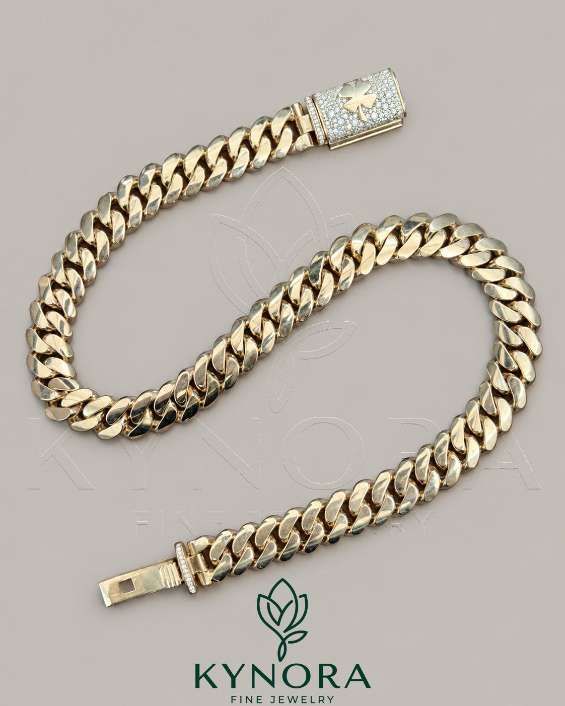 14mm gold Miami Cuban chain with custom clasp and moissanite diamonds, featuring a sleek, plain design by Kynora Jewels.