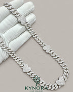14mm heart-shaped 10mm Miami Cuban chain by Kynora Jewels, crafted in 925 sterling silver with a diamond finish.
