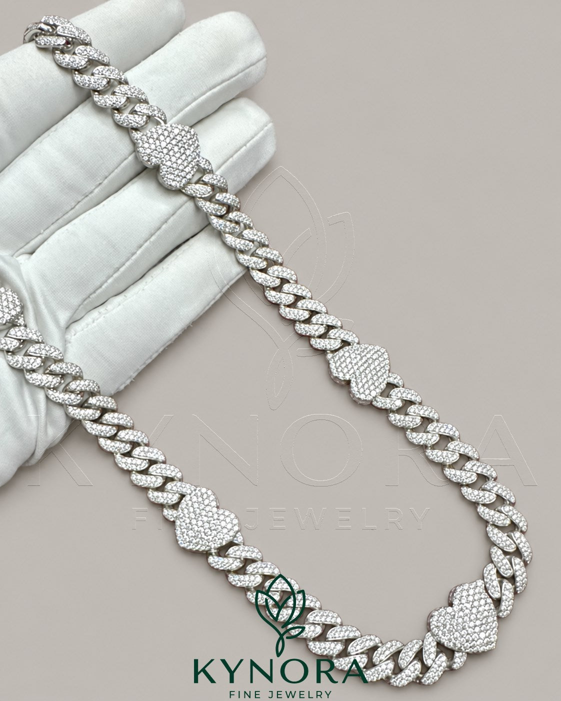 14mm heart-shaped 10mm Miami Cuban chain by Kynora Jewels, crafted in 925 sterling silver with a diamond finish.