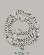 Sterling silver 14mm heart shape and 10mm Miami Cuban chain hip hop jewelry by Kynora Jewels, featuring diamond accents.