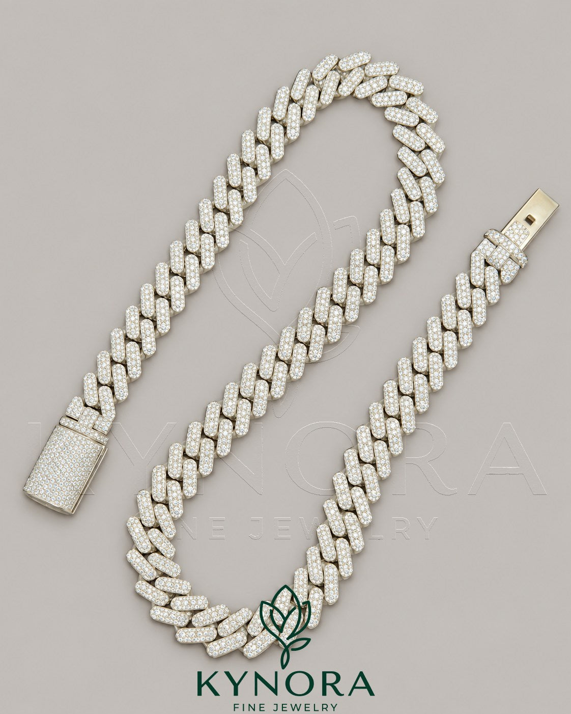 14mm VVS Moissanite diamond silver Cuban link chain by Kynora Jewels, featuring white gold accents and 18-inch sterling silver design.