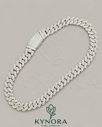 16mm silver moissanite Cuban link chain by Kynora Jewels, showcasing a bold hip-hop style jewelry piece with sparkling stones.