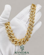 Sterling silver and gold Cuban link chain with 16mm VVS1 moissanite diamonds, hip hop style from Kynora Jewels.