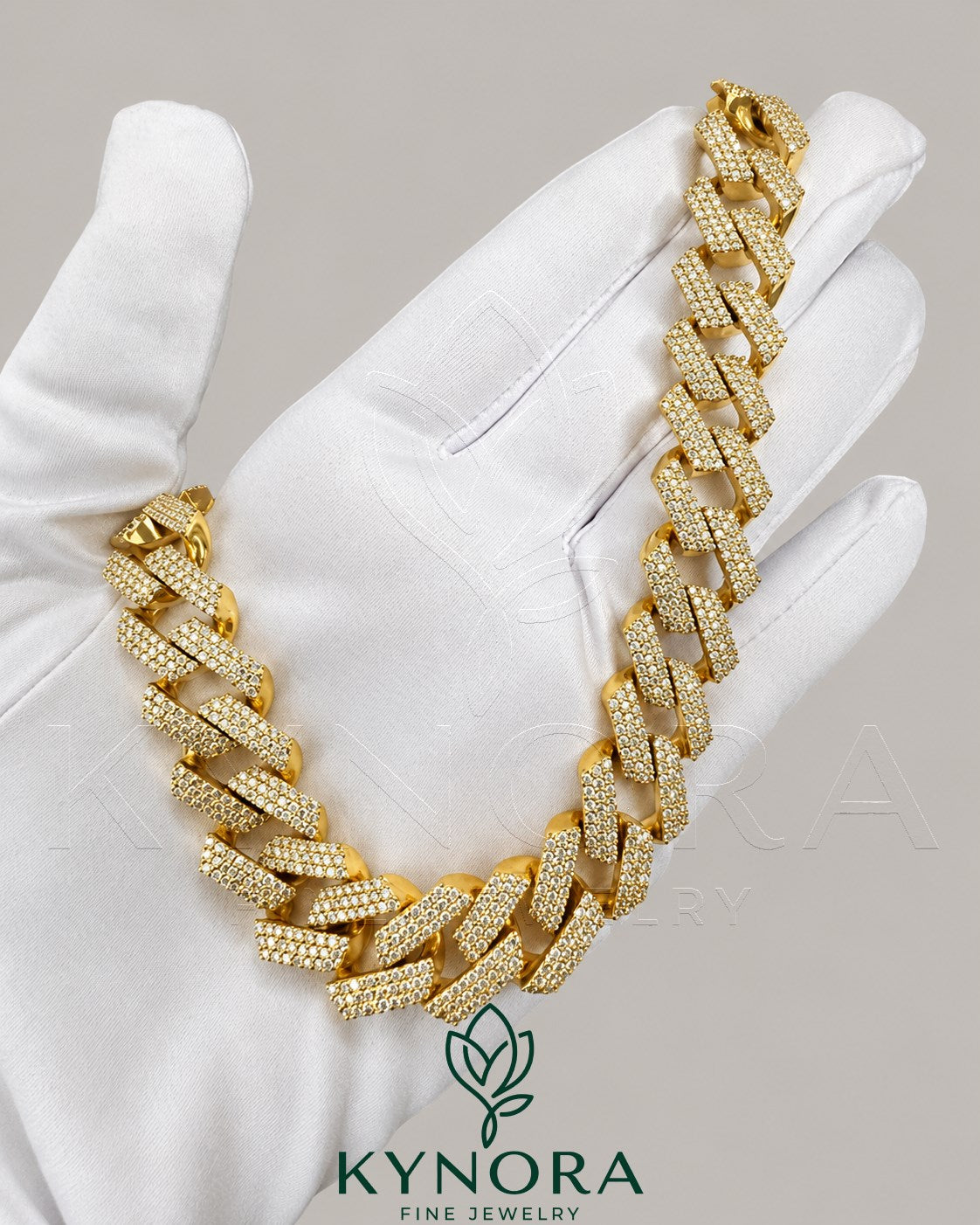 Sterling silver and gold Cuban link chain with 16mm VVS1 moissanite diamonds, hip hop style from Kynora Jewels.