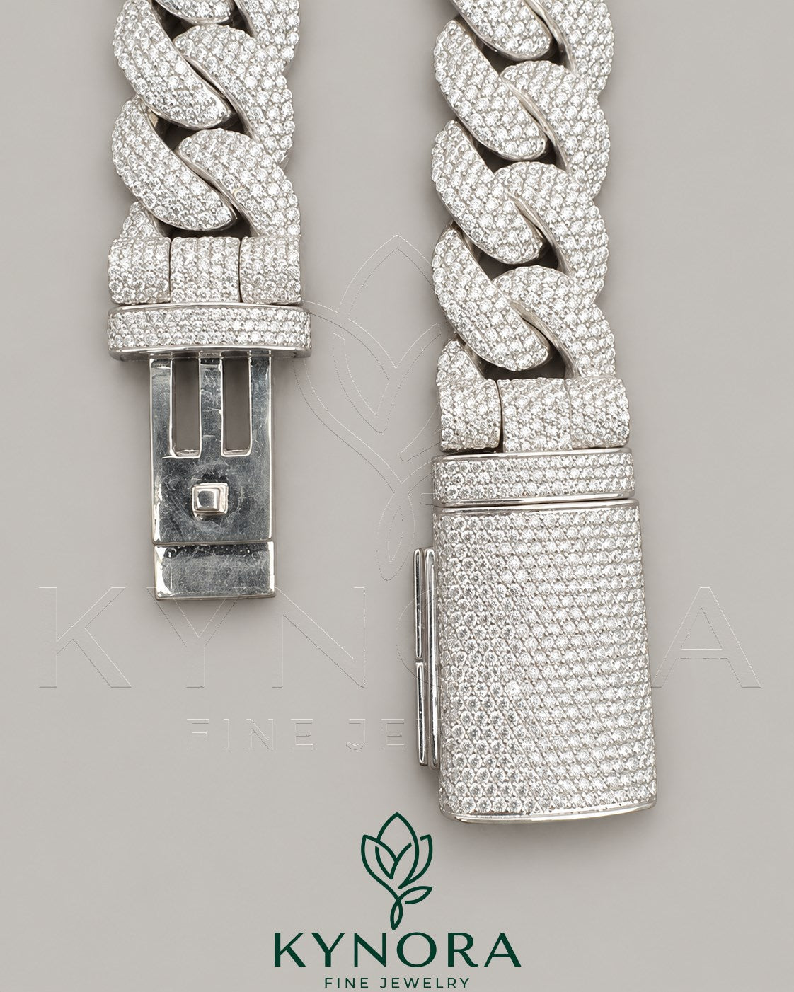 Sterling silver VVS1 moissanite Cuban link chain, 20mm hip-hop jewelry by Kynora Jewels with intricate design and shine.