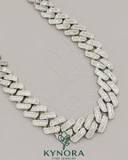20mm VVS1 Moissanite diamond silver Cuban link chain, hip-hop jewelry by Kynora Jewels, featuring shiny, intricate silver links.