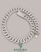 22mm VVS1 Moissanite sterling silver Cuban link chain, hip-hop style jewelry by Kynora Jewels with sparkling diamond-like stones.