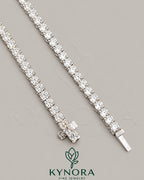 Sterling silver 3mm VVS Moissanite diamond tennis link chain by Kynora Jewels, stylish hip-hop jewelry accessory.