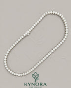 Sterling silver 18-inch tennis chain with 5.5 mm VVS1 moissanite diamonds, featuring a hiphop chain style from Kynora Jewels.