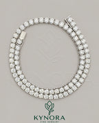 Sterling silver 18-inch tennis chain with 5.5mm VVS1 moissanite diamonds, designed for hip-hop jewelry style.