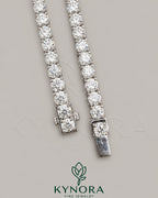 Sterling silver tennis chain with 5.5mm VVS1 moissanite diamonds, 18-inch hip-hop chain by Kynora Jewels.
