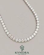 Sterling silver VVS1 moissanite diamond tennis chain necklace with 6mm links, styled as a hip-hop chain by Kynora Jewels.