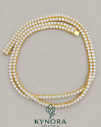 Yellow gold plated sterling silver tennis chain featuring 6mm VVS1 moissanite diamonds, hip-hop style jewelry by Kynora Jewels.