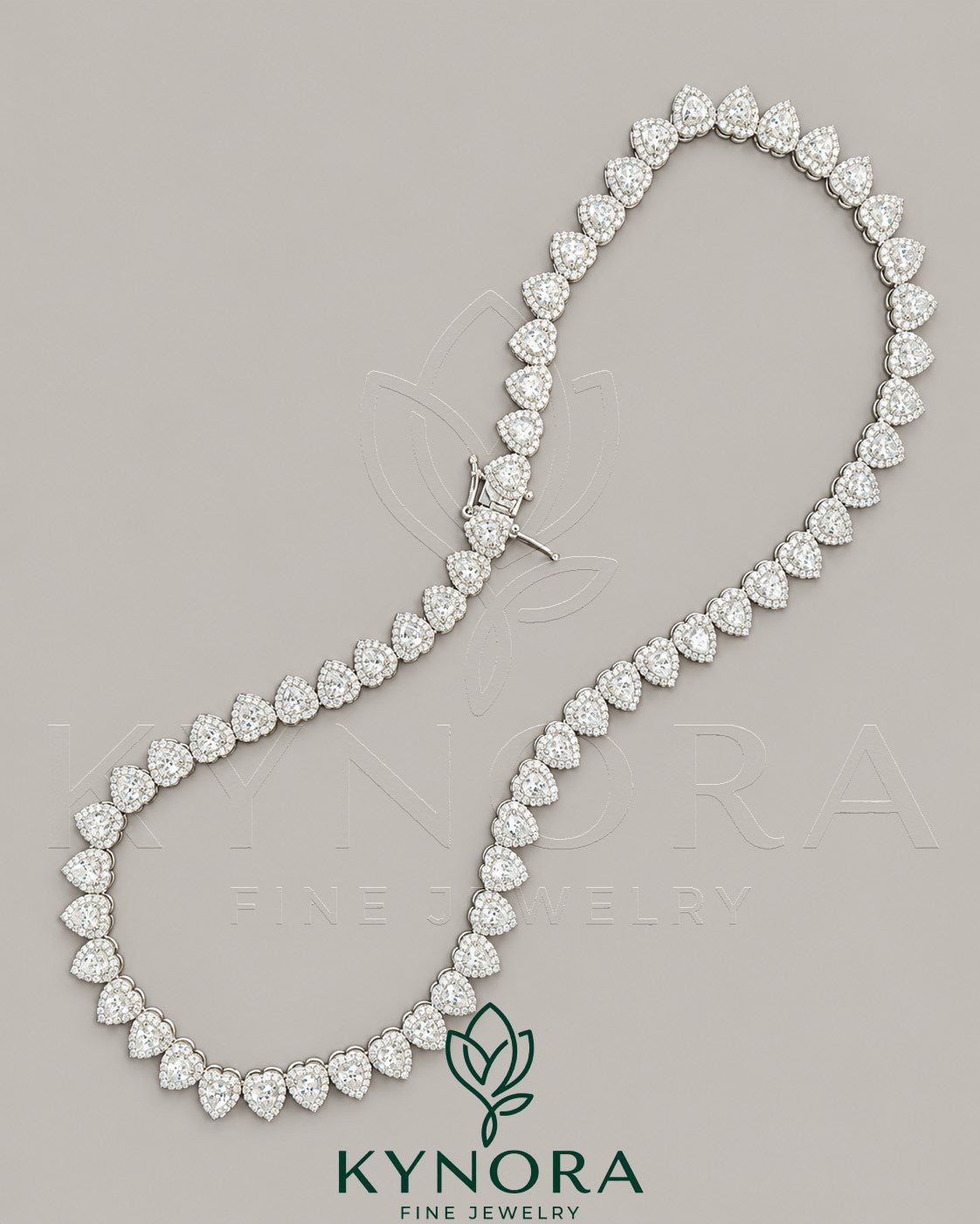 Heart-shaped moissanite diamond halo pendant on sterling silver tennis link chain, featuring a 7mm VVS1 moissanite from Kynora Jewels.