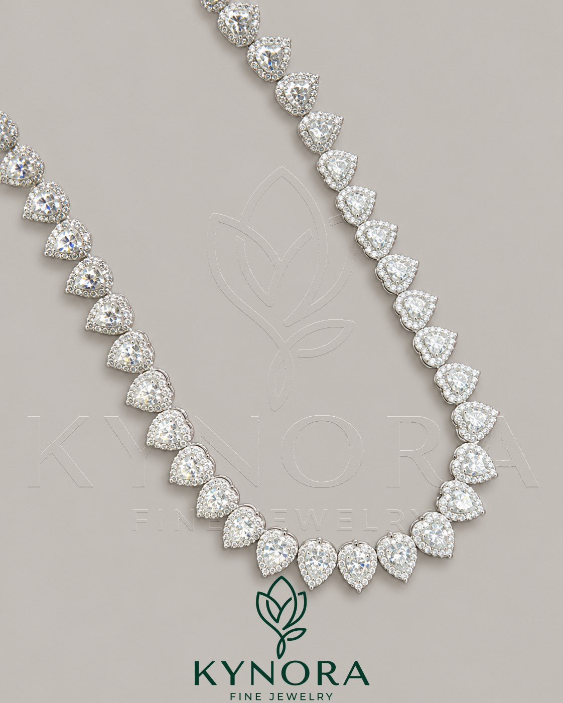 Heart-shaped moissanite diamond halo pendant on a 7mm sterling silver tennis link chain, stylish hip-hop jewelry by Kynora Jewels.