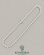Sterling silver heart-shaped moissanite diamond halo hiphop chain with 7mm VVS1 stones and tennis link design by Kynora Jewels