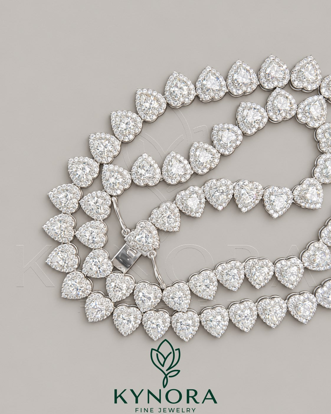 Heart-shaped sterling silver tennis link chain with 7mm VVS1 moissanite diamond halo, hip-hop style from Kynora Jewels.
