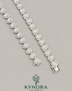Sterling silver heart-shaped moissanite diamond halo hip-hop chain with tennis link design by Kynora Jewels