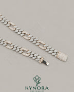 Kynora Jewels FIGARO Style 12mm VVS1 Moissanite Cuban Link Chain in sterling silver, showcasing its shiny, intricate design.