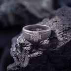 Men's titanium ring with pave moissanite cross design in 10k yellow gold, showcasing intricate detail and polished finish.
