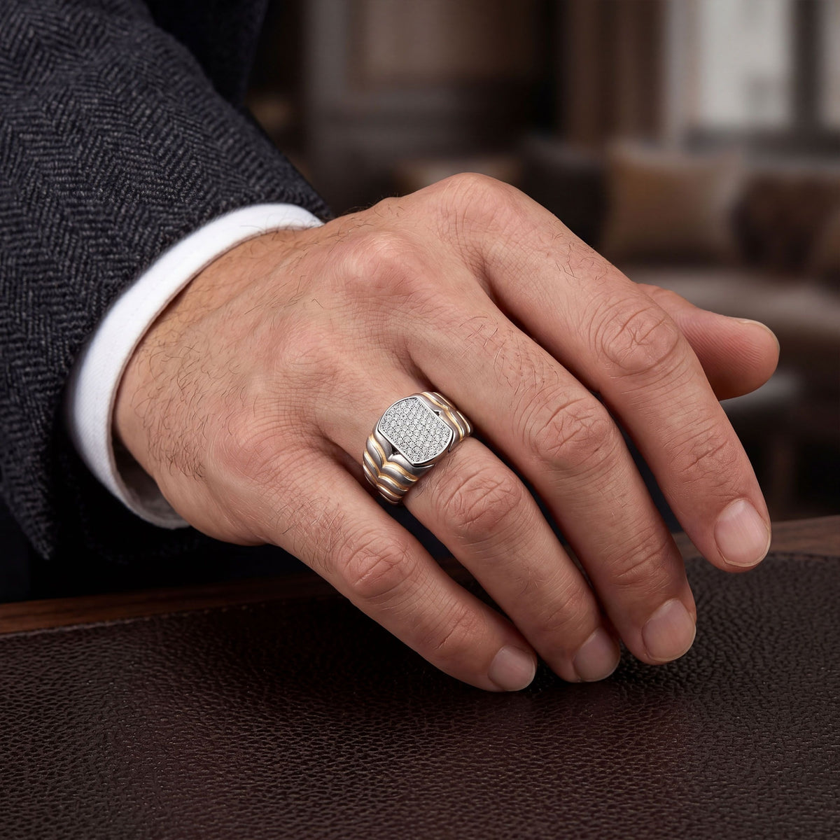 Men's two-tone titanium ring with pave moissanite accents in 10k yellow gold and titanium, stylish and durable jewelry from Kynora Jewels.