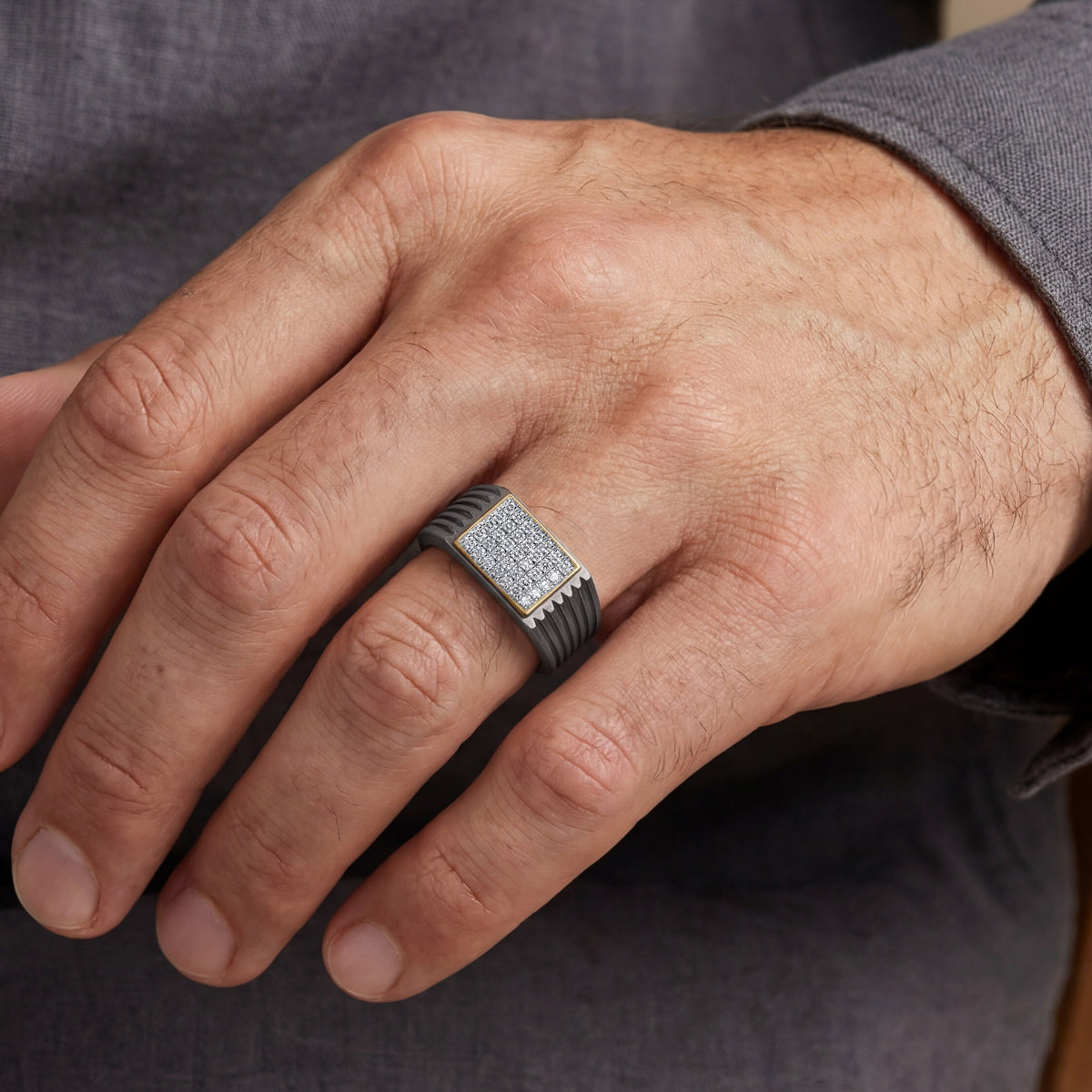 Men's rectangular pave moissanite ring in 10k yellow gold and titanium, featuring a sleek design and sparkling gemstone accents.