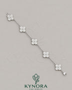 925 Sterling Silver Moissanite Diamond Hip Hop Bracelet with van clef design by Kynora Jewels showing close-up of sparkling jewelry.