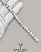 Kynora Jewels 5mm round cut VVS1 moissanite diamond hip hop tennis bracelet with sparkling stones and silver setting.