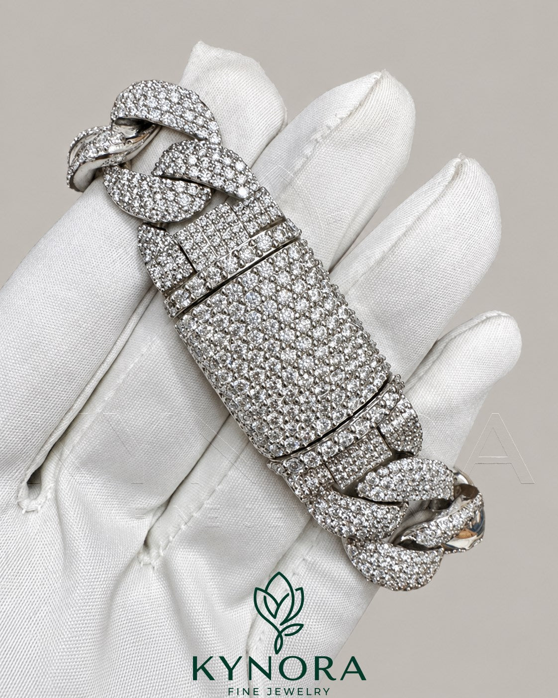 20mm moissanite diamond sterling silver Cuban hip hop bracelet by Kynora Jewels featuring bold, shiny gemstone-studded chain.