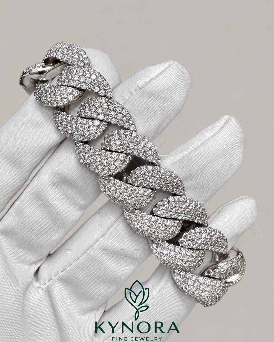 Sterling silver 20mm Moissanite diamond Cuban hip hop bracelet with bold links, featuring sparkling gemstone accents from Kynora Jewels.