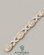 Sterling silver 12mm iced out infinity evil eye unisex bracelet by Kynora Jewels, featuring sparkling gemstone accents and a sleek design.