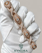 Unisex 12mm iced out infinity evil eye bracelet by Kynora Jewels, made of 925 sterling silver with sparkling stones, hip-hop style accessory.