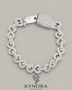 Kynora Jewels 10mm VVS1 Moissanite diamond infinity bracelet featuring a hip-hop style design with sparkling stones and intricate links.