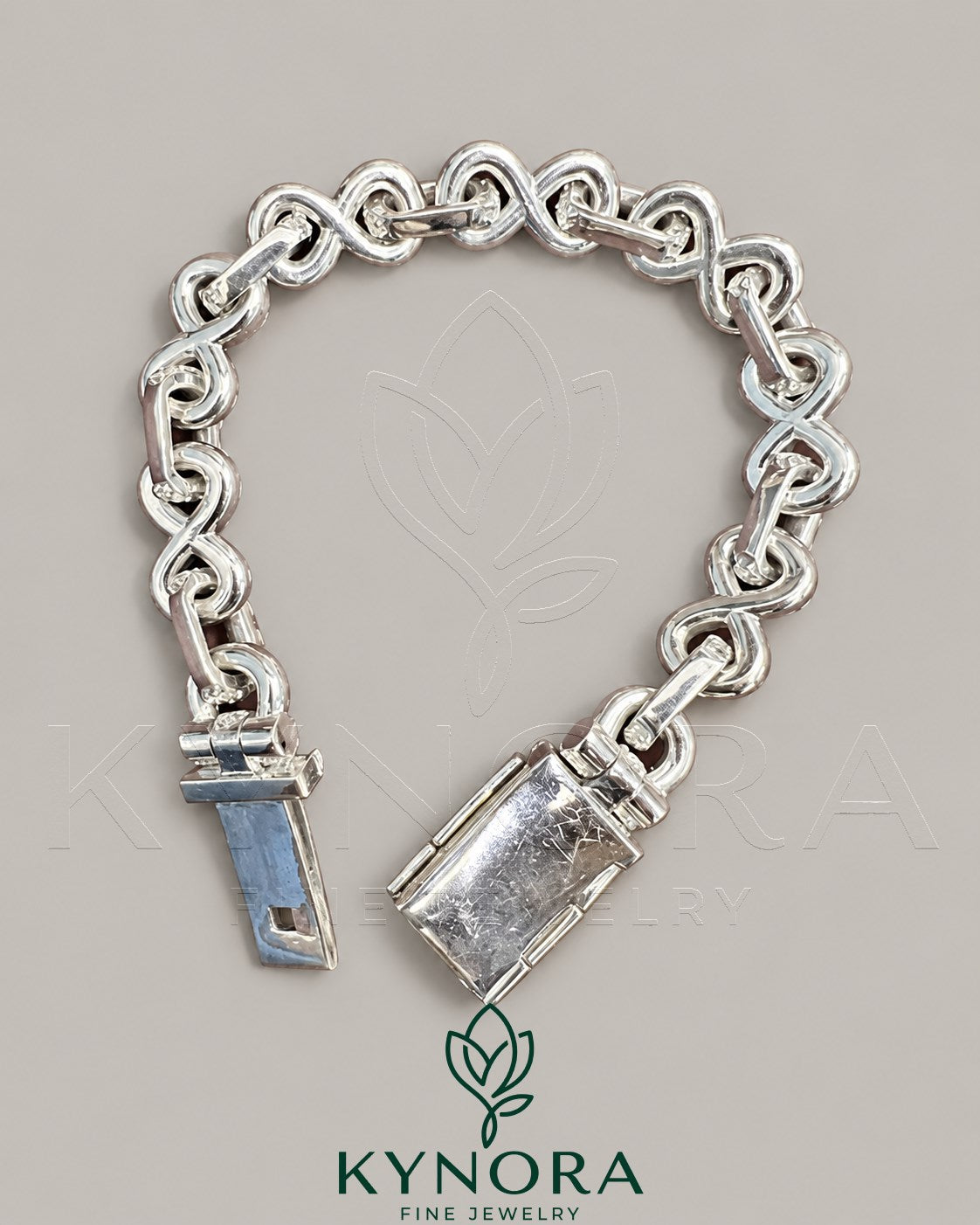 Kynora Jewels 10mm VVS1 Moissanite diamond infinity bracelet with hip-hop style design, featuring sparkling stones and gold finish.