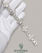 Fully iced out cross moissanite hip hop diamond bracelet from Kynora Jewels featuring sparkling, detailed jewelry with cross pendant design.