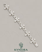 Fully iced-out cross moissanite hip hop diamond bracelet by Kynora Jewels with sparkling stones and bold design.