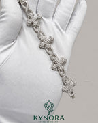 Fully iced out cross moissanite hip hop bracelet by Kynora Jewels featuring sparkling diamond accents and bold design.