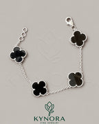 Sterling silver Van Cleef-style hip-hop bracelet by Kynora Jewels featuring black finish and bold design.