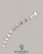 VVS1 Moissanite diamond silver hip-hop bracelet by Kynora Jewels featuring bold chain links and sparkling gemstone accents.
